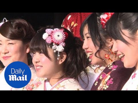 Japanese 20-year-olds flock to shrines in traditional costumes - Daily Mail